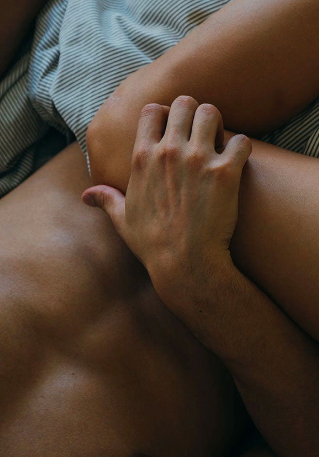close up photo of an arm and hand and torso