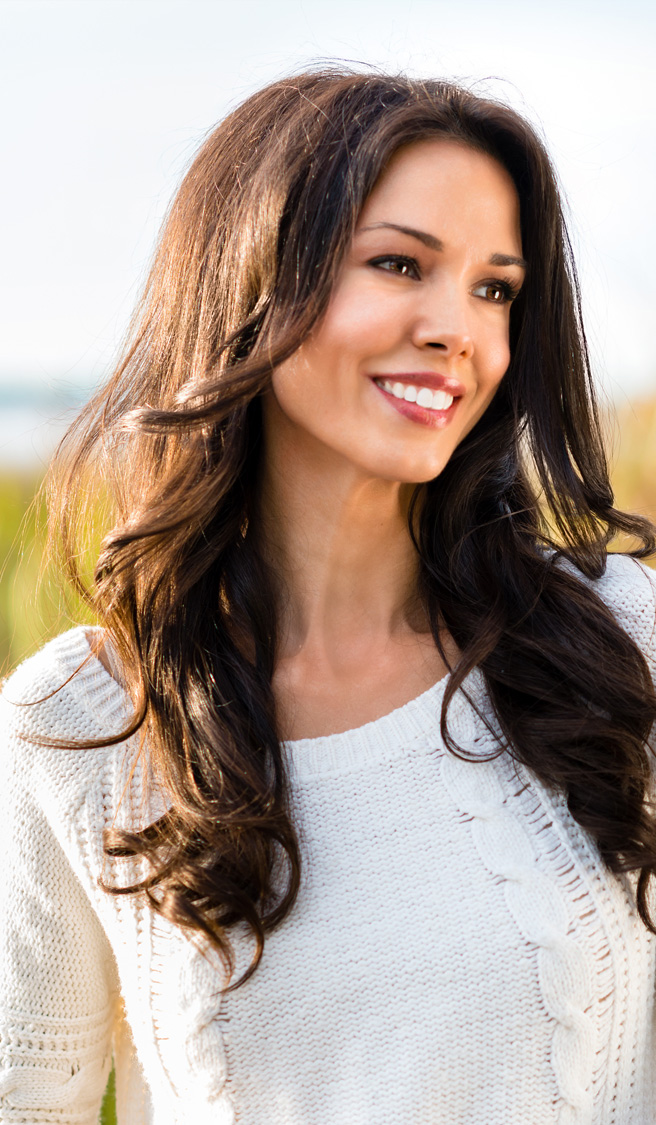 Happy young woman on nature walk