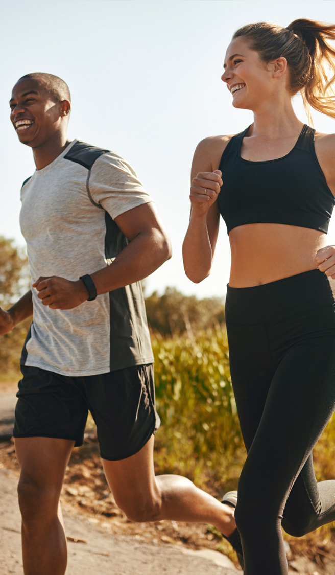 Fitness, running and health with couple in road for workout, cardio performance and summer.