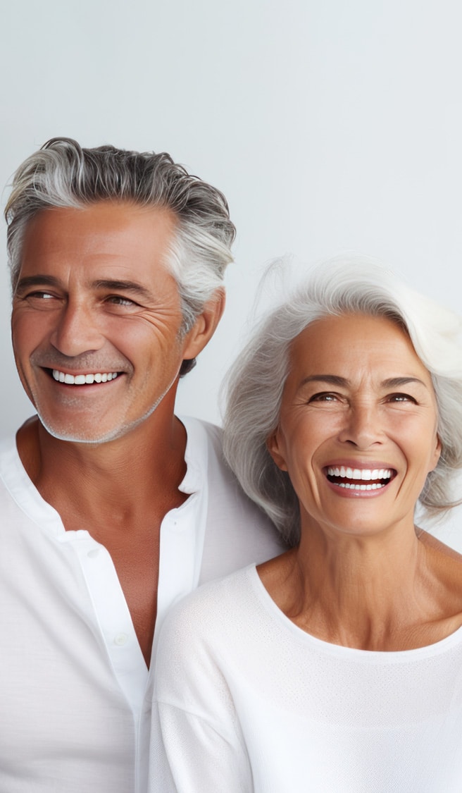 Beautiful gorgeous 50s mid age elderly senior model couple with grey hair laughing and smiling. Mature old man and woman close up portrait. Healthy face skin care beauty, skincare cosmetics, dental.