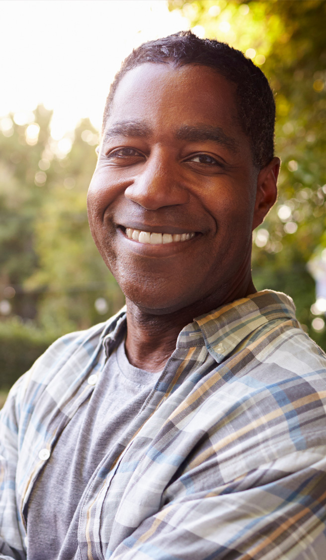 Portrait Of Mature Man In Back Yard Garden