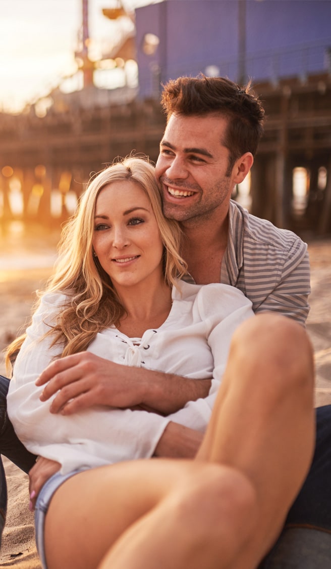 romantic couple having fun at santa monica on beach